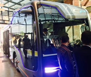 The autonomous bus shown with people in front and some inside